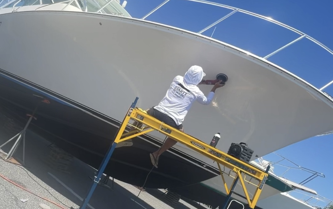 Buffing and polishing a boat hull during gel coat restoration